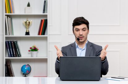 A candidate sitting in front of a computer during a virtual interview