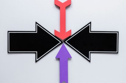 A crossroads sign with arrows pointing to different job options