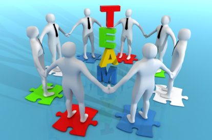 A jigsaw puzzle with pieces labeled communication teamwork and leadershi
